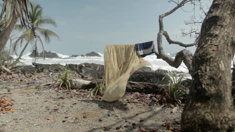 breezy yellow linens flutter under the sun with the blue sea glistening behind.