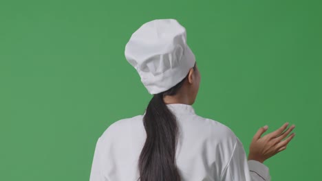 vista trasera del chef en la pantalla verde