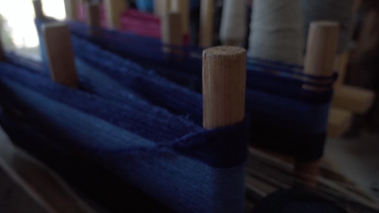 Dyed sheep's wool prepared on a traditional wooden machine