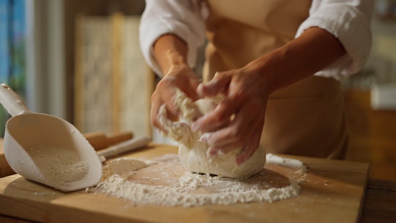 Woman Kneading Dough for Baking Bread