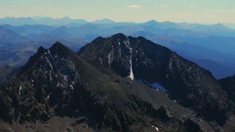 three apostles collegiate peaks rugged huron peak summit 14er rocky mountains colorado drone aerial hike climb summer fall autumn glacier snow la plata buena vista sunny blue sky circle right motion