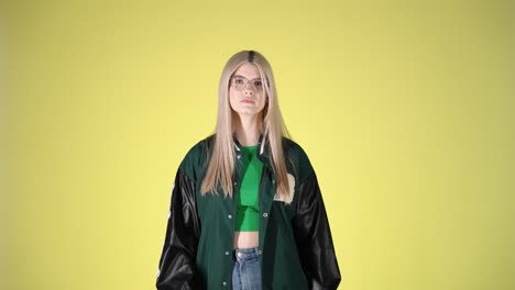 young blonde woman displeased, nonverbal disagreement no gesture, studio portrait