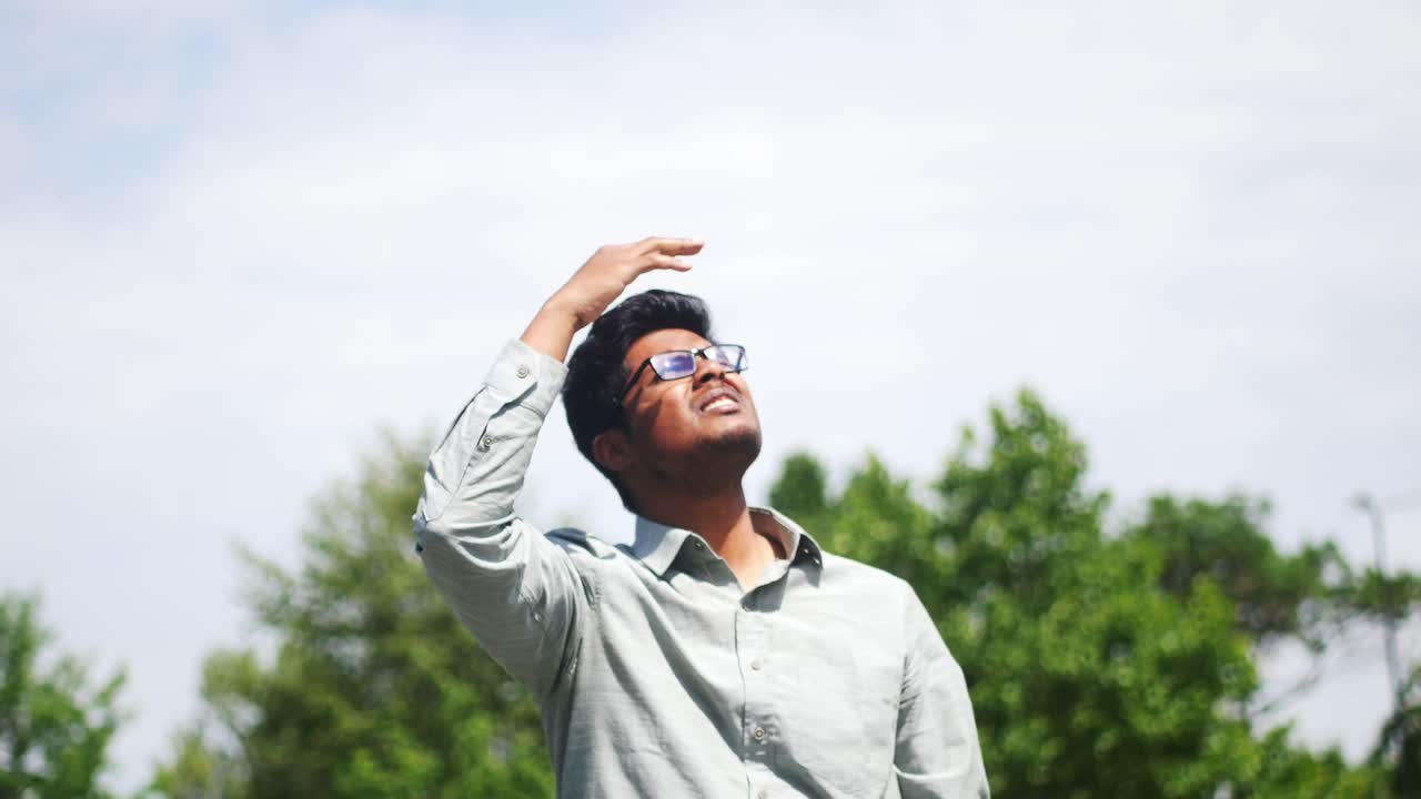 Man Looking Up in the Sun