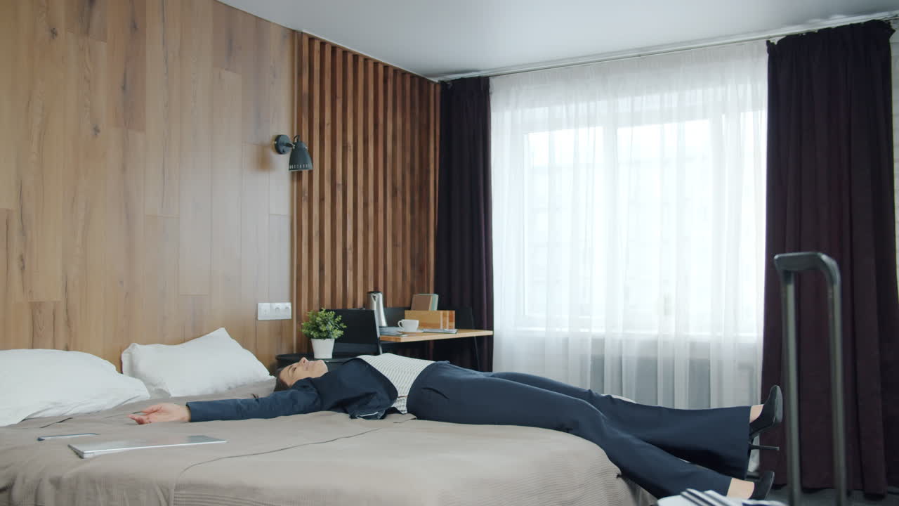 Businesswoman resting in hotel room