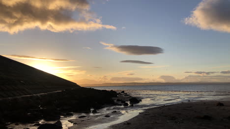 puesta de sol en la playa de portobello en edimburgo escocia
