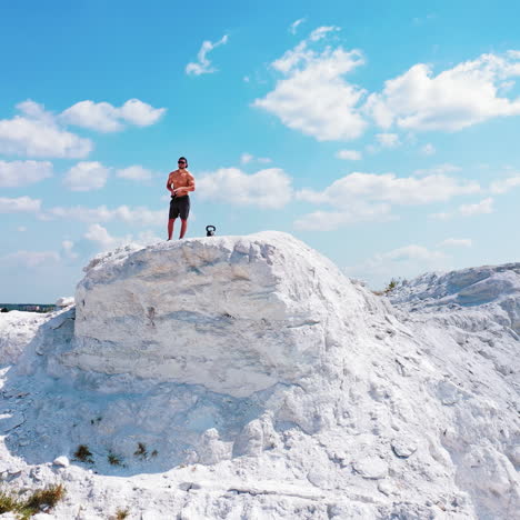 man working out on a hilltop