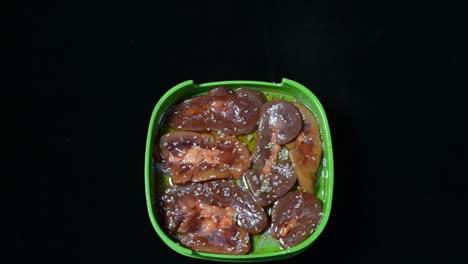 Marinated-Meat-And-Seafood-Placed-In-Green-Plastic-Container