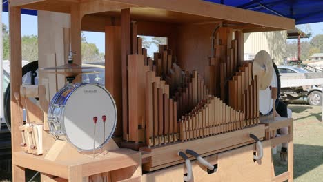 wooden organ and drum playing music outdoors