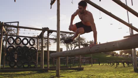 Young-man-training-at-an-outdoor-gym-bootcamp
