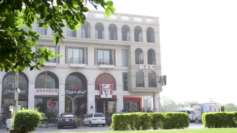 kfc, pizza hut, and other restaurants in a commercial building