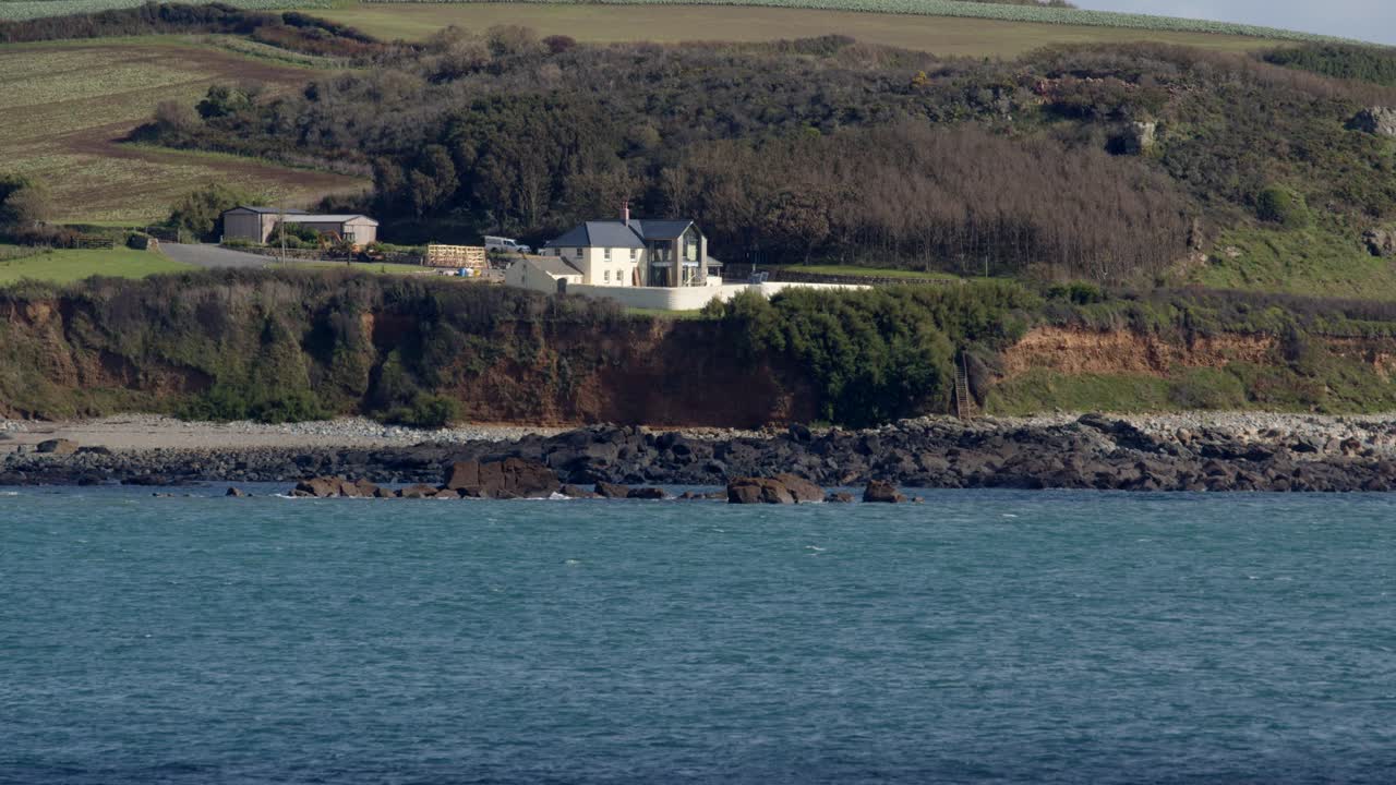wide shot looking east from Saint Michael's mount on to a seaside property at mounts bay