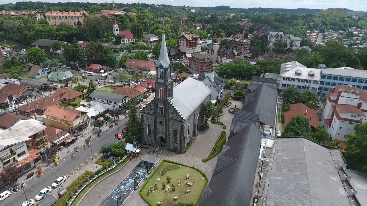 Cinematic drone aerial reveal shot of Saint Peter's Church (Igreja Matriz São Pedro) in downtown Gramado Rio Grande do Sul Brazil. High quality 1080p Slow Motion