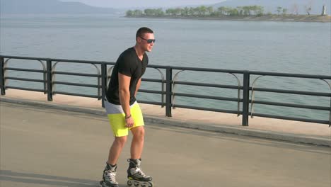 man rollerblading by the water