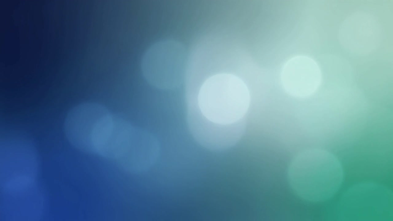Círculos de luces bokeh en movimiento sobre un fondo degradado azul verdoso