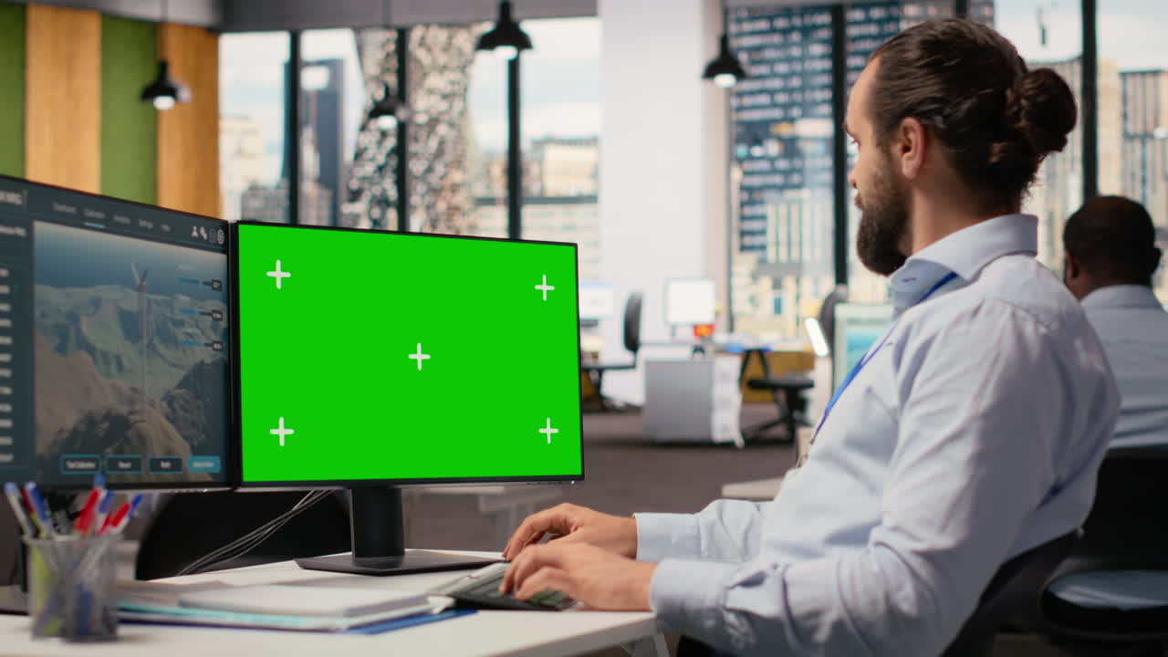 Worker Uses Green Screen Mockup Pc To Optimize Advanced Vawt Wind Farm