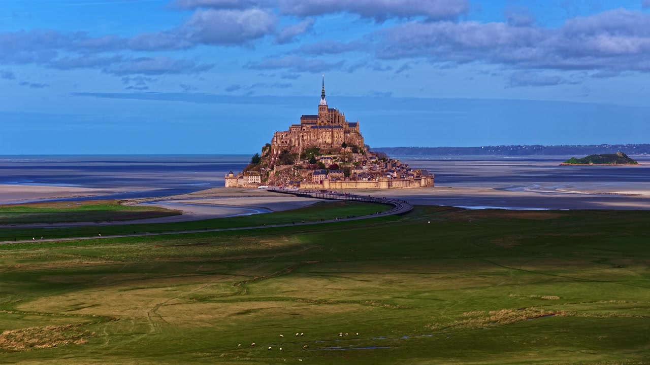 Mont Saint-Michel, a magnificent island abbey and historic monument in France, aerial timelapse