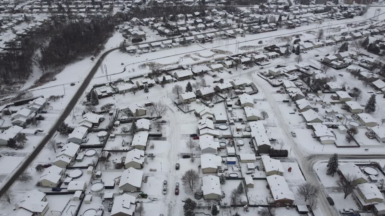 Snow covered houses St. Constant, Quebec, Canada during winter. Snow covered houses with swimming pools in the back yard