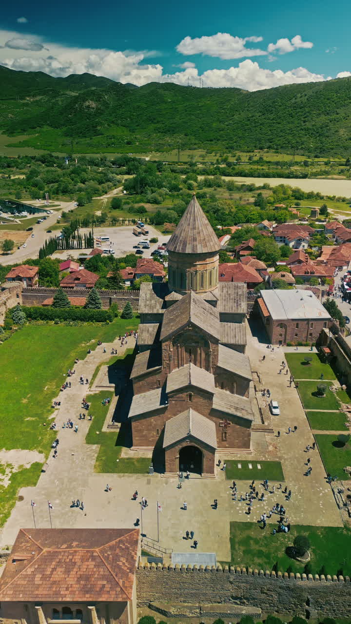 Aerial View of a Georgian Cathedral and Surrounding Area