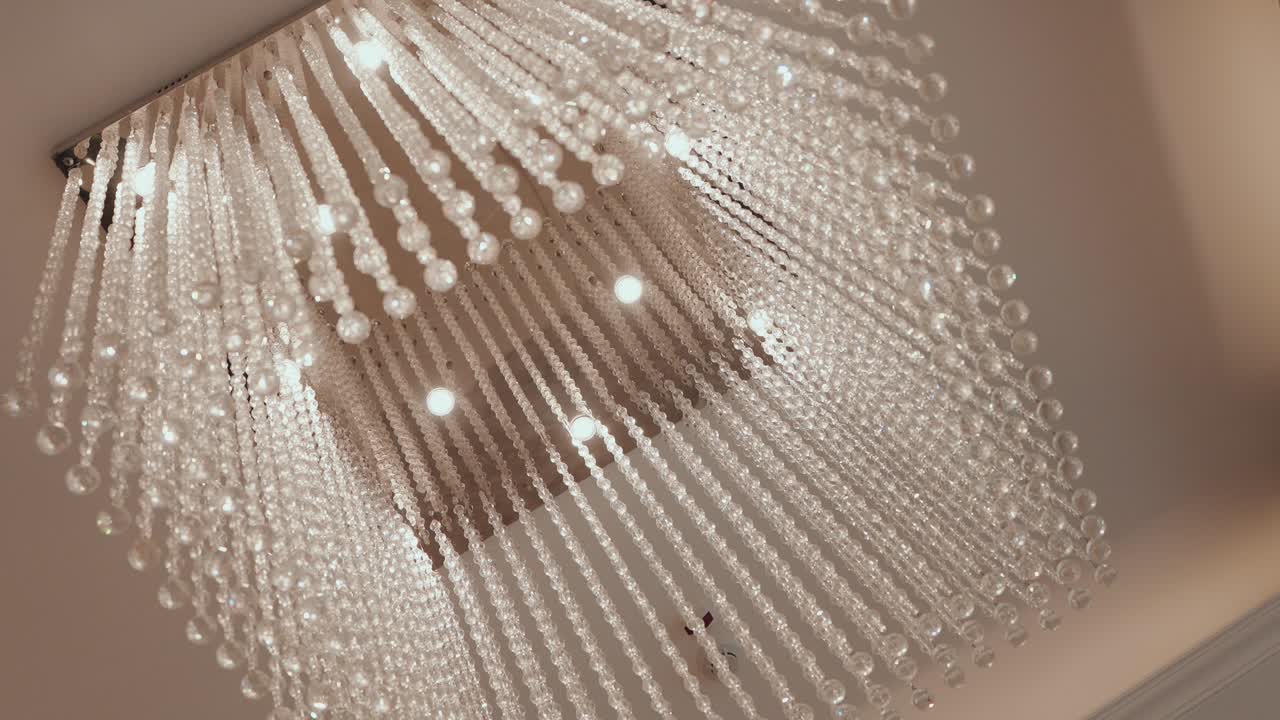 Closeup of sparkling crystal chandelier with hanging strands