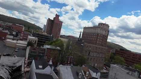 cityscape panorama with historic and modern buildings under a cloudy sky