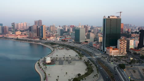 Traveling-front,-Luanda-city,-golden-hour-flying-over-Luanda-bay,-Africa-#4