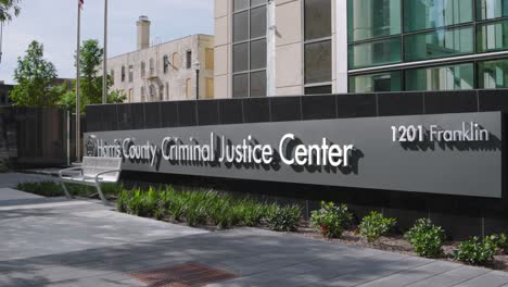 establishing shot of the harris county criminal justice center in houston, texas