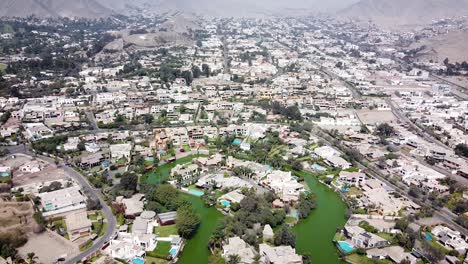 drone shot of of lake houses in the suburbs of lima peru