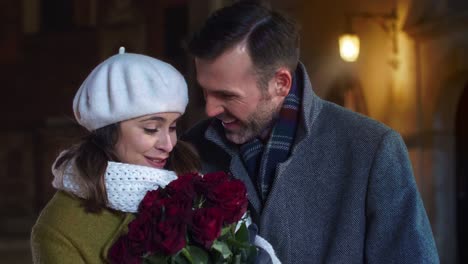 mature man giving a bunch of roses