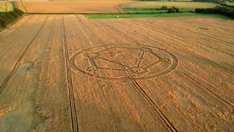 fortnite molecular atom crop circle design sunset harvest meadow aerial drone view in wiltshire push in to birdseye