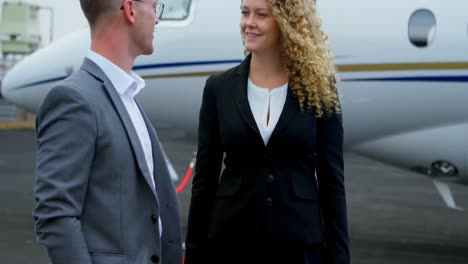 business people interacting with each other at terminal 4k