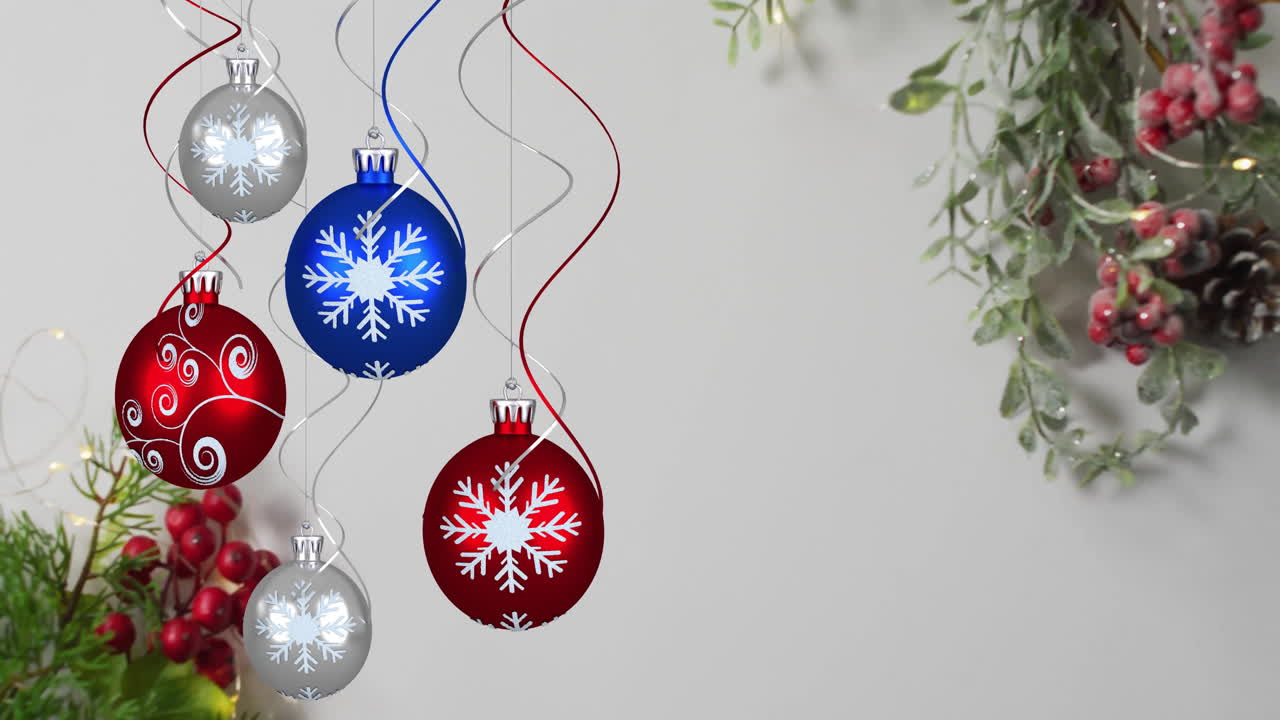 Christmas ornaments with snowflakes and ribbons over holiday greenery animation