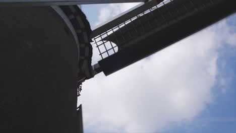 restricted view of propellors of a windmill rotating