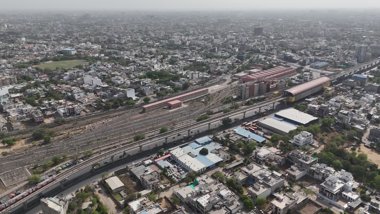 Scenic view of Jaipur's packed residential areas with metro train passing through the city