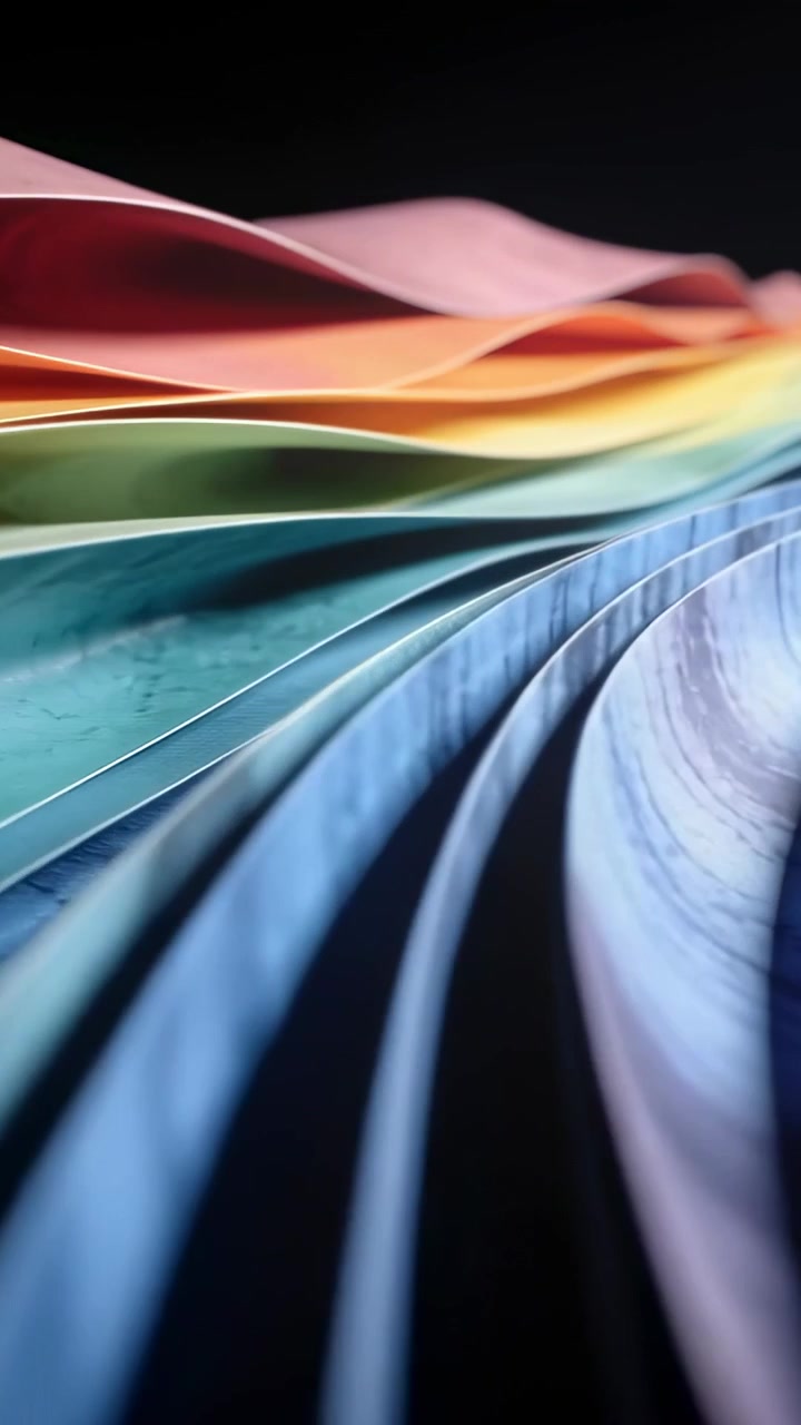 Vertical video: Panning camera starting revealing thin color sheets in studio to reveal gradient