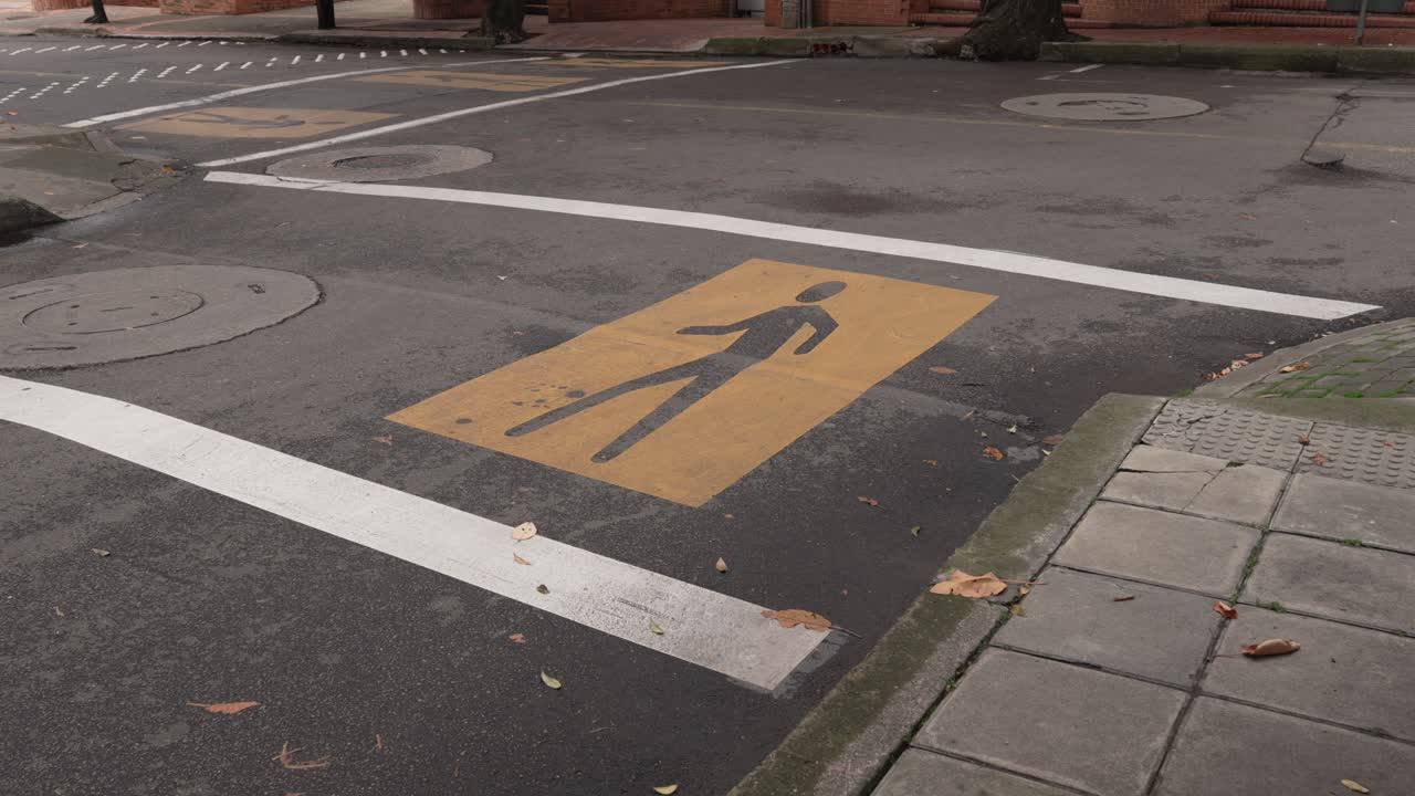 Pedestrian crossing on a road, marked with yellow in Bogota Colombia South America