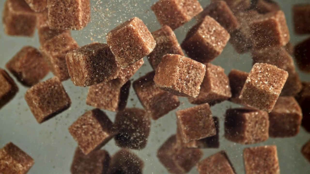 Brown Sugar Cubes Falling in Slow Motion