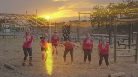 animation of sunset over diverse women at obstacle course jumping