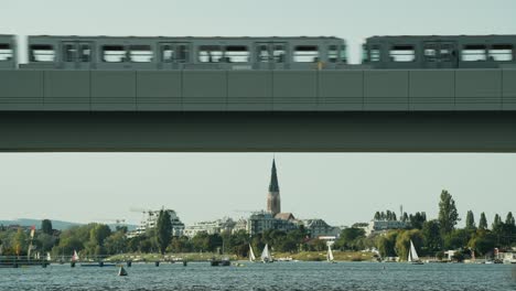 railway or metro passing over railway bridge in vienna alte donau