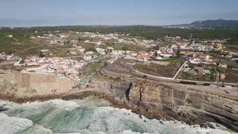 Portugal-resort-cliffside-town-Azenhas-Do-Mar,-aerial-rotate-view