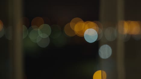 blurred background from a night window covered with tulle