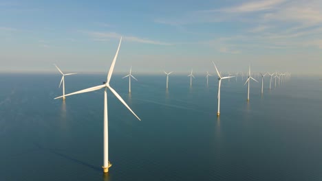 huge windmill turbines, offshore windmill farm in the ocean westermeerwind park , windmills isolated at sea on a beautiful bright day netherlands flevoland noordoostpolder