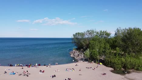 aerial view of beachgoers on a sunny day at a toronto beach on lake ontario