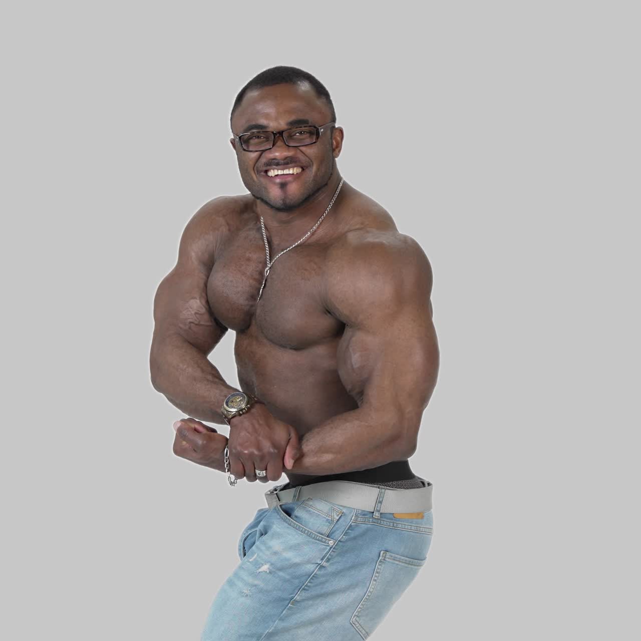 African male model posing shirtless. African male bodybuilder doing bodybuilding pose