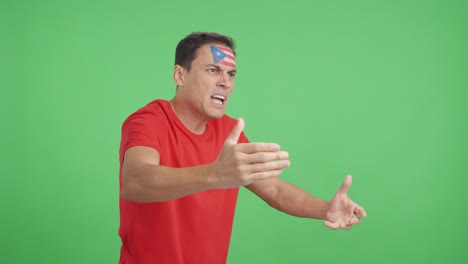Man cheering for Puerto Rico, angry with the decision of referee