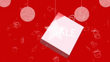 Christmas-bauble-and-star-hanging-against-sale-text-on-shopping-bag-against-red-background