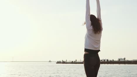 woman enjoying the sunset at the beach