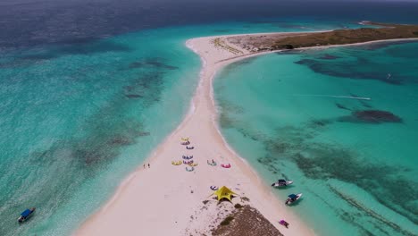 aerial view tilit up sandbank with kites lying on sand beach, cayo de agua tropical island