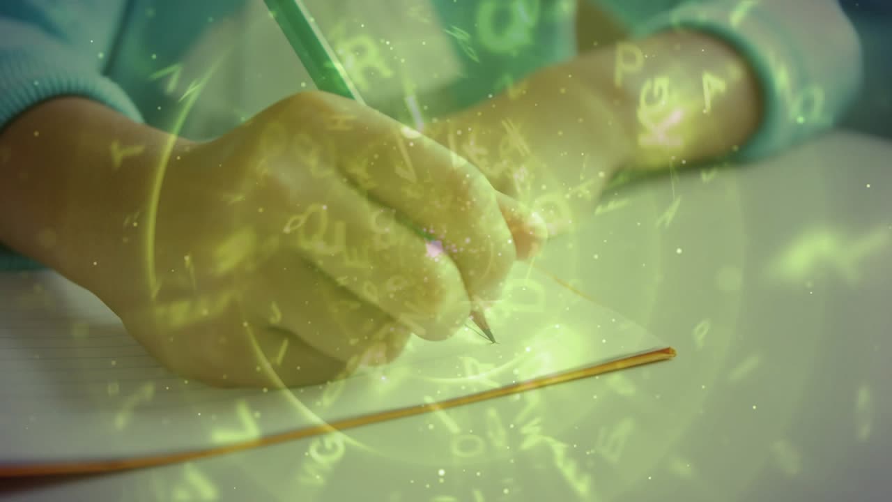 Child's right hand touching paper, making pencil marks while glyphs focusing, showing letters