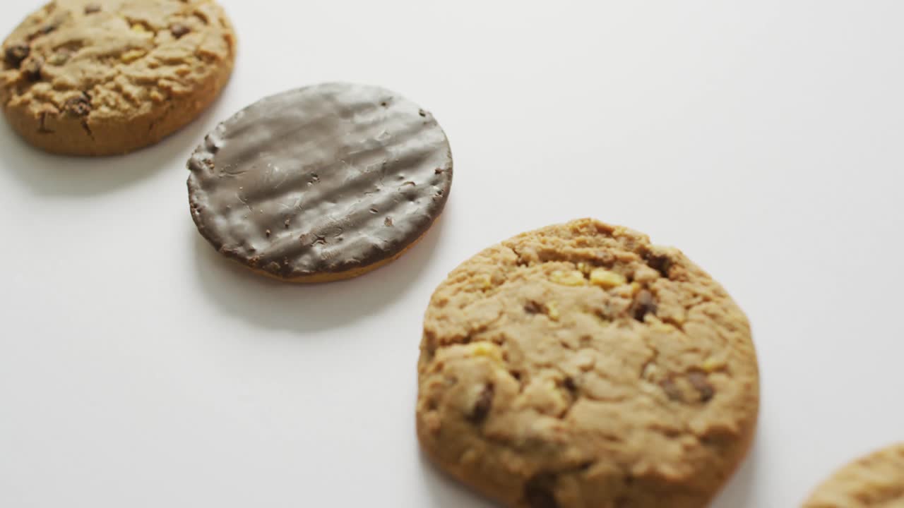 Video of biscuits with chocolate over white background