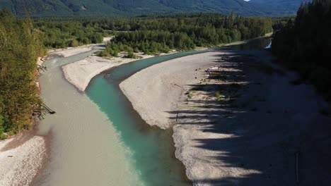 aerial view of river confluence in green forested landscape of washington state usa